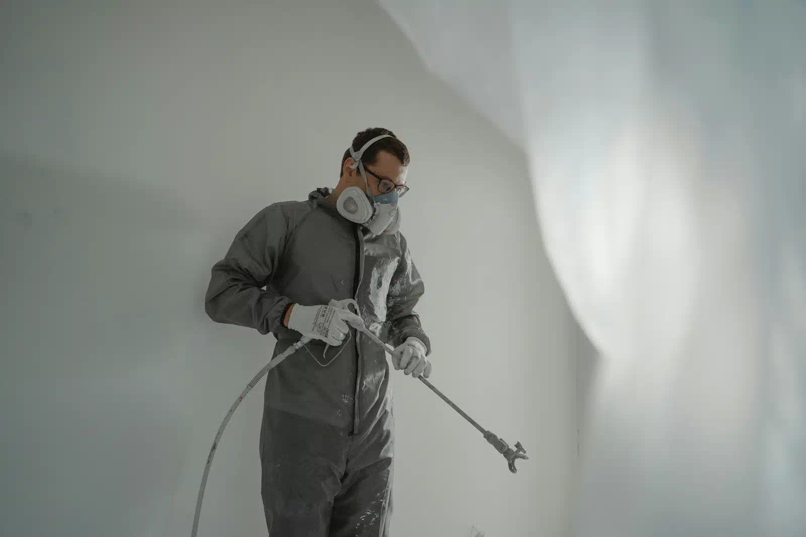 Professional painter estimating interior painting cost in Jacksonville home